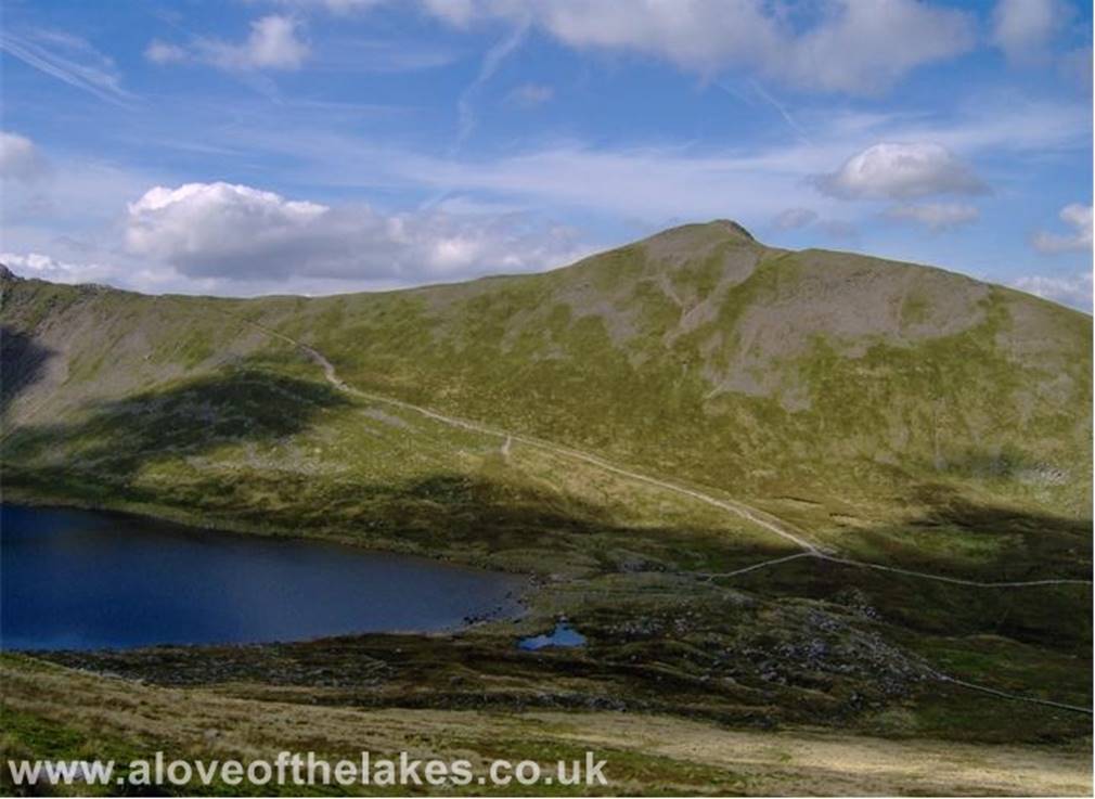 A love of the Lakes - From the hole in the wall make a left turn and climb up to High Spying How  the first rock tower at the start of Striding Edge. Here a shot of
Swirral Edge and Catstye Cam across Red Tarn
