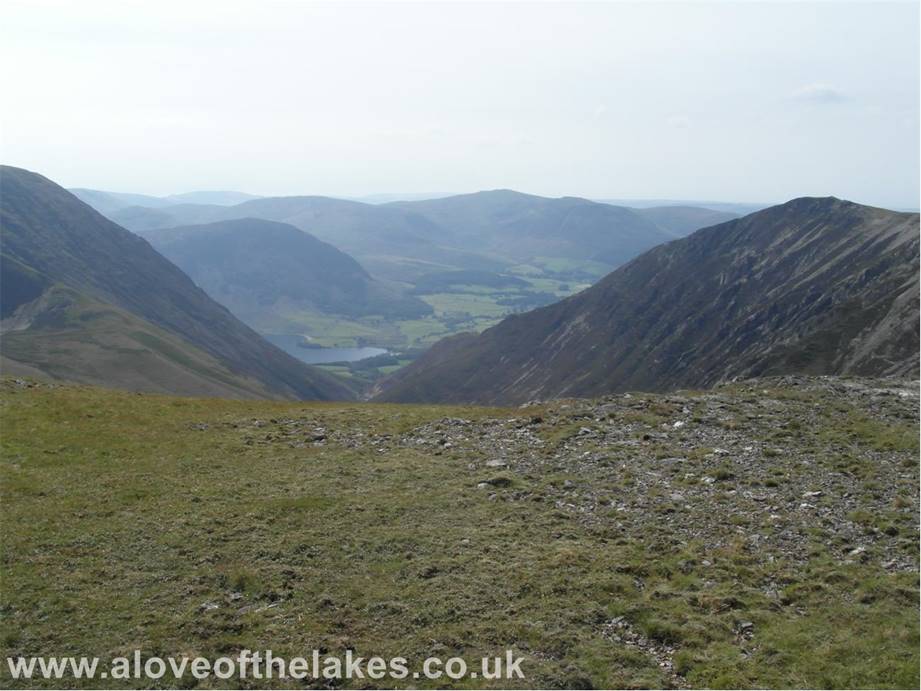 A love of the Lakes - From the summit I drop down to Coledale Hause. Here a brief view to Crummock Water and the north tower of Melbreak


