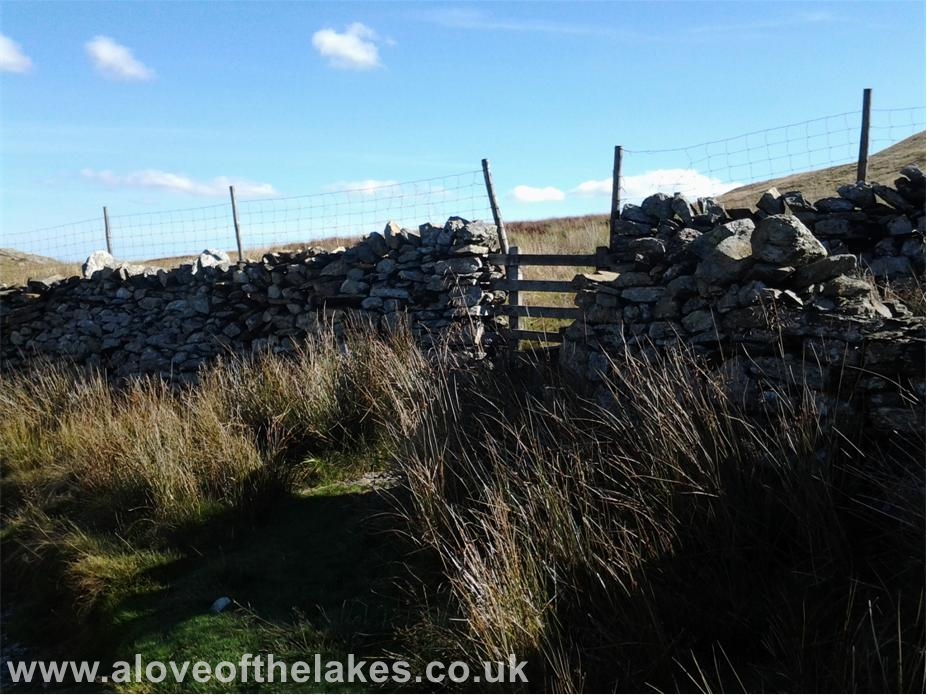 A love of the Lakes - The wall stile leads on to the open fellside