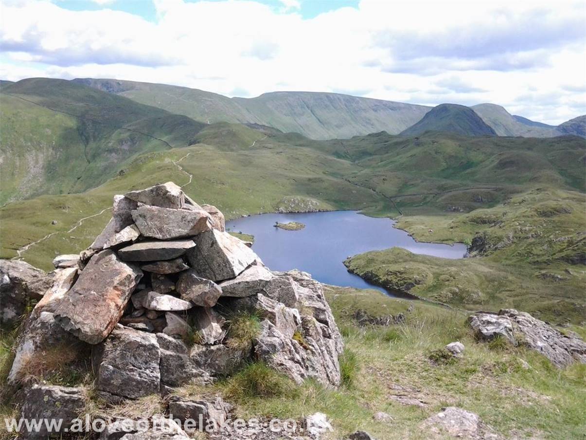 The summit cairn of the South Tower with Angle Tarn below  absolutely stunning