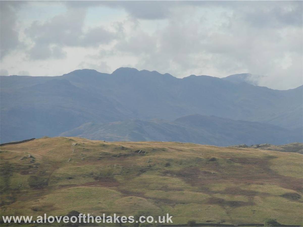 Looking across the Troutbeck Valley and above the Wansfell ridge line towards Crinkle Crags in the Langdale valley