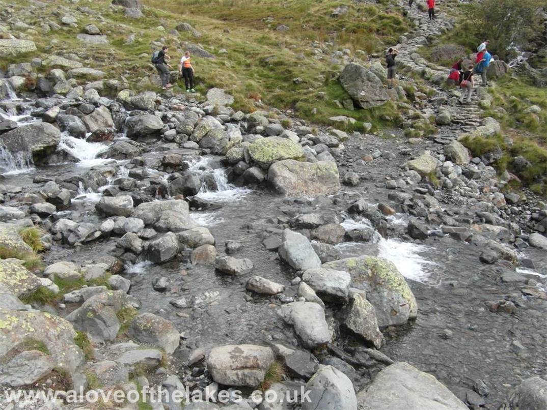 Crossing the Gill to follow the path up to Hollow Stones