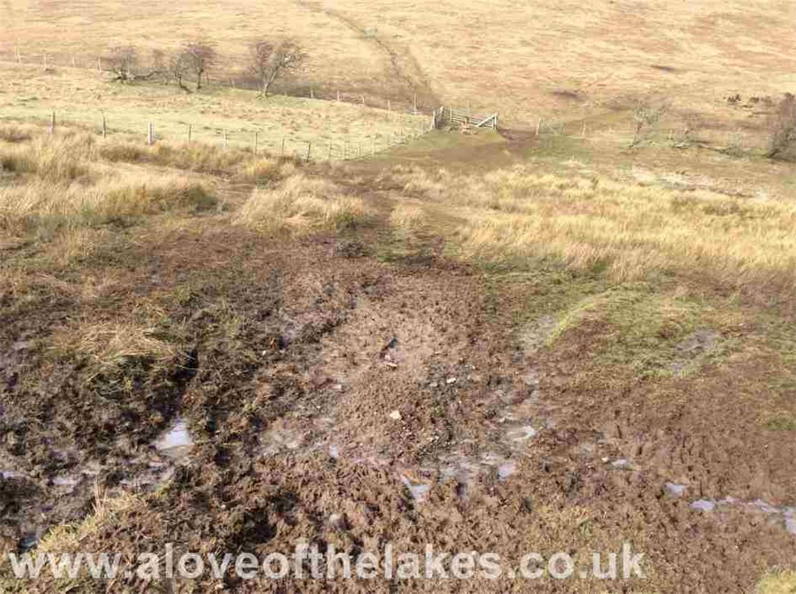 Wade through the mud across to a broken gate to gain direct access to the open fell side