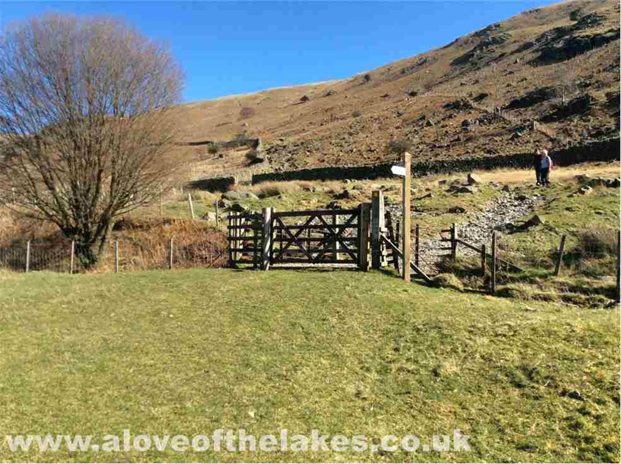 Through the gate and access to the open fell is gained by crossing the Thirlmere Reservoir water race
