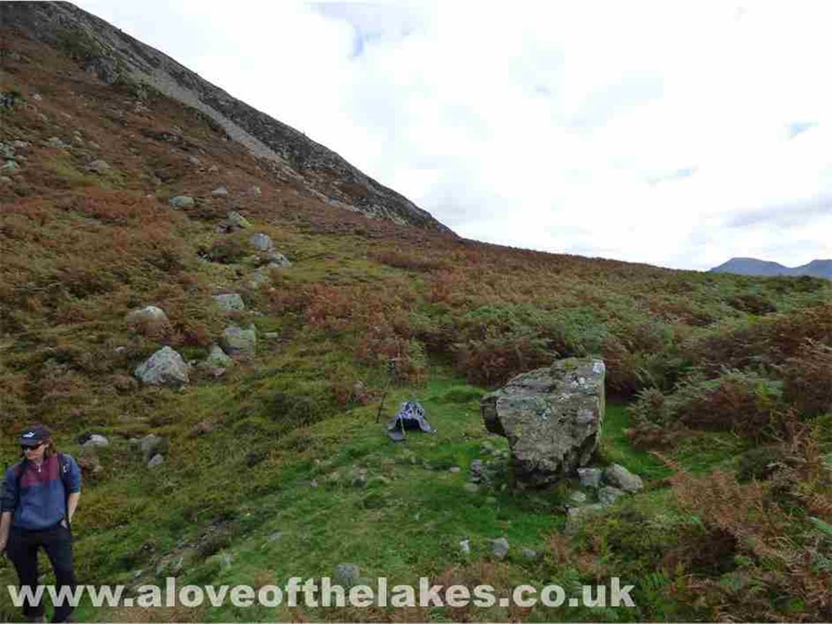 Nearing the top of the Col and this big boulder indicates a left turn towards some steeper ground over a grass path