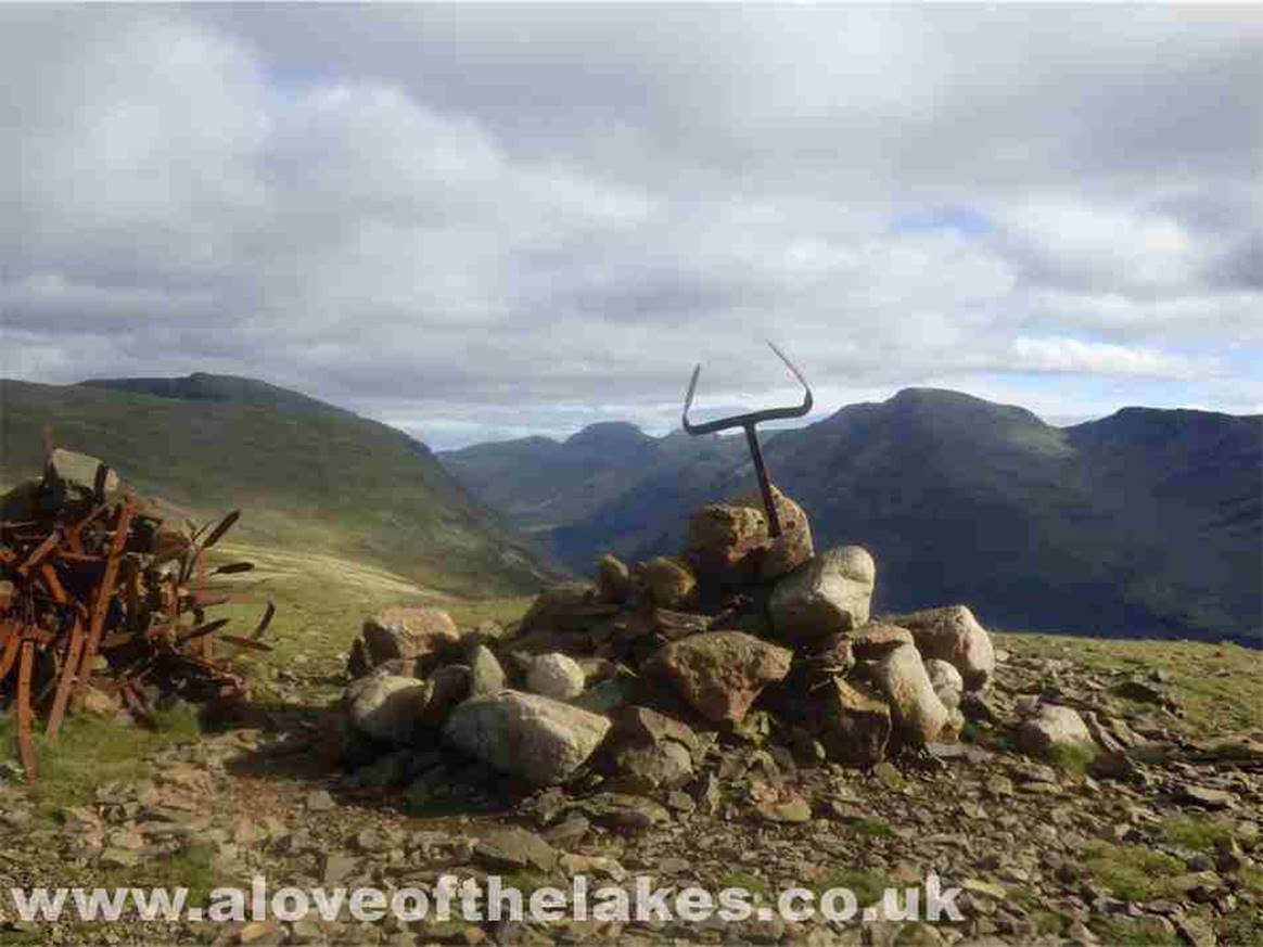 We eventually reach the very unusual summit cairn of Starling Dodd