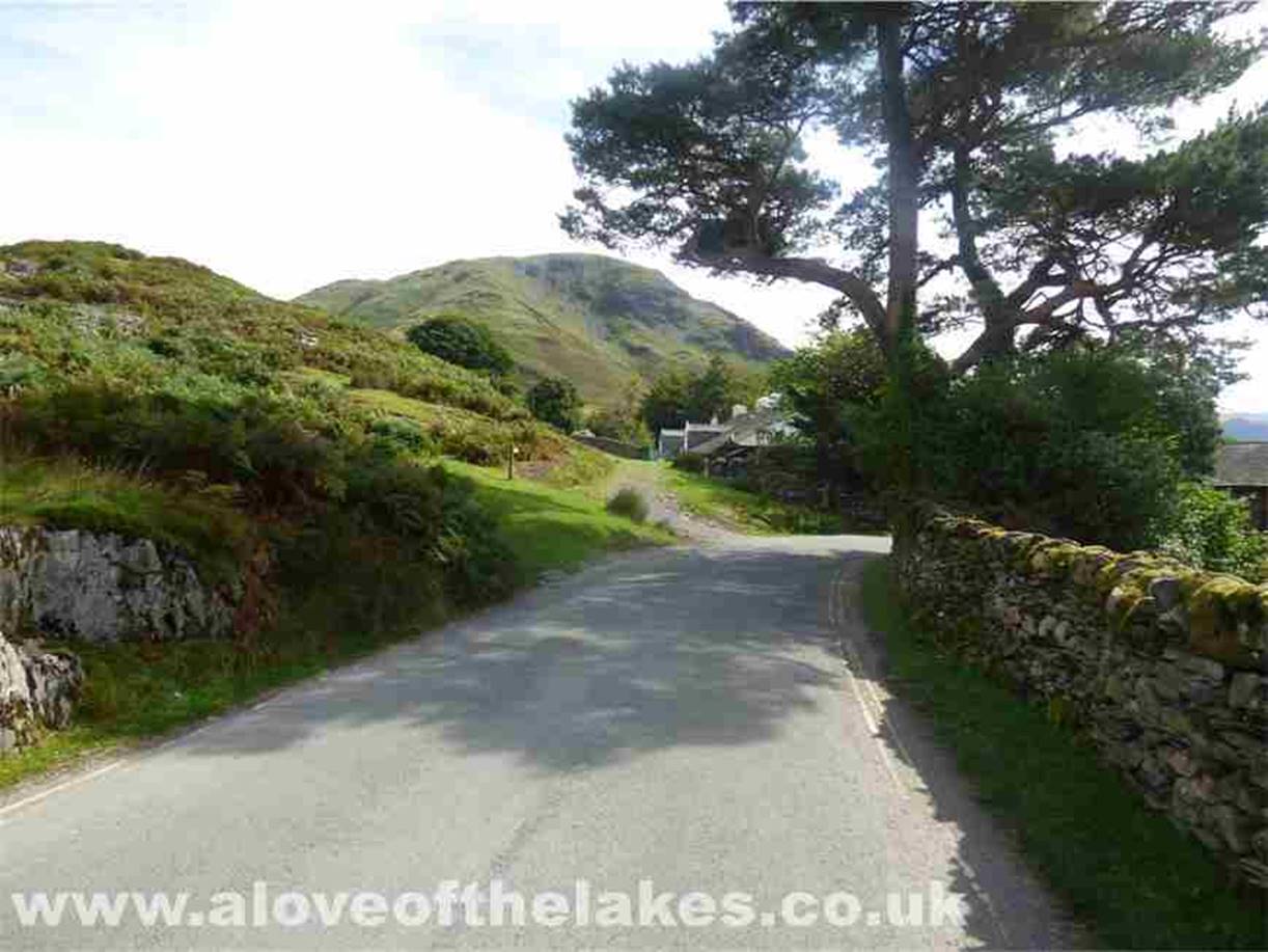 From the entrance of the car park turn right and just slightly further down on the left a stoned path turns off and head 
past a row of cottages heading out to the valley of Sail Beck
