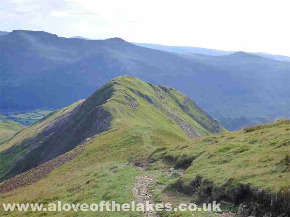 The four of us set out to cross the dramatic ridge leading up to Wandope. Here looking back down the ridgeline