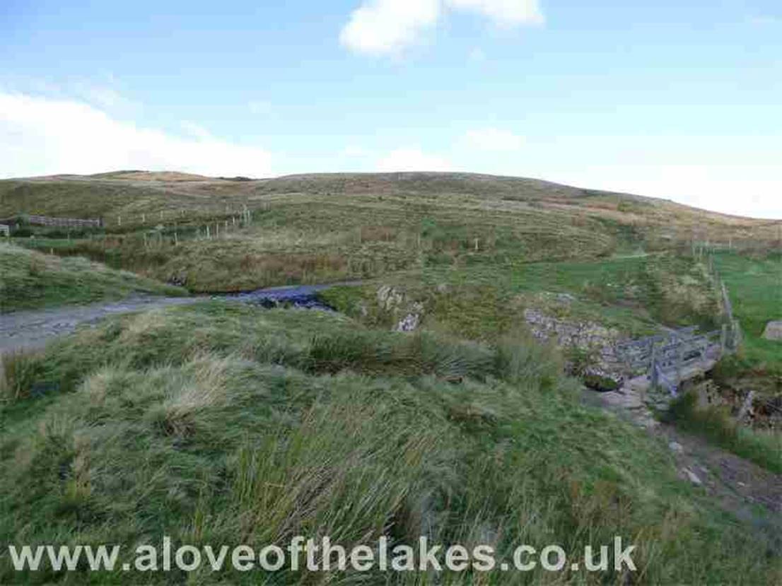 After about a third of a mile, turn right initially at Groove Beck to pick up the footpath to Great Dodd