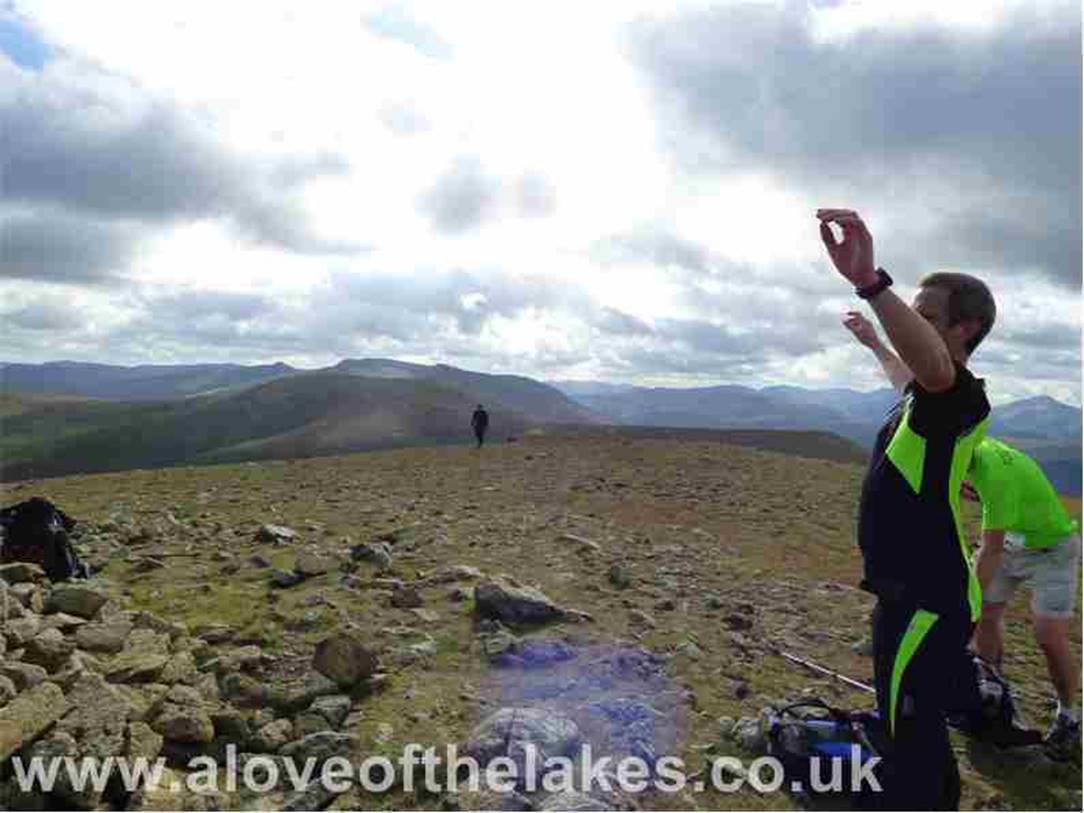 At the summit shelter cairn on Great Dodd and it was teaming with competitors running the Lakes in the Day 55 mile
challenge starting from Threlkeld and taking in the likes of Clough Head, Great Dodd, Helvellyn and Dale Head
finishing up in Cartmell  a remarkable feat of endurance
