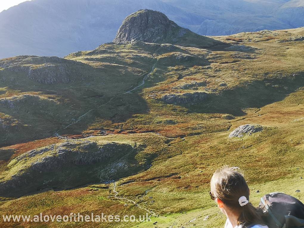 Sue looks back along the path up to the summit of Harrison Stickle