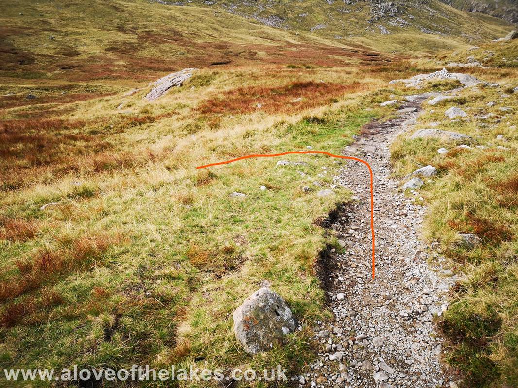 Just before you reach a neat little cairn by the side of the path, another very subtle and minor path turns off
to the left 
