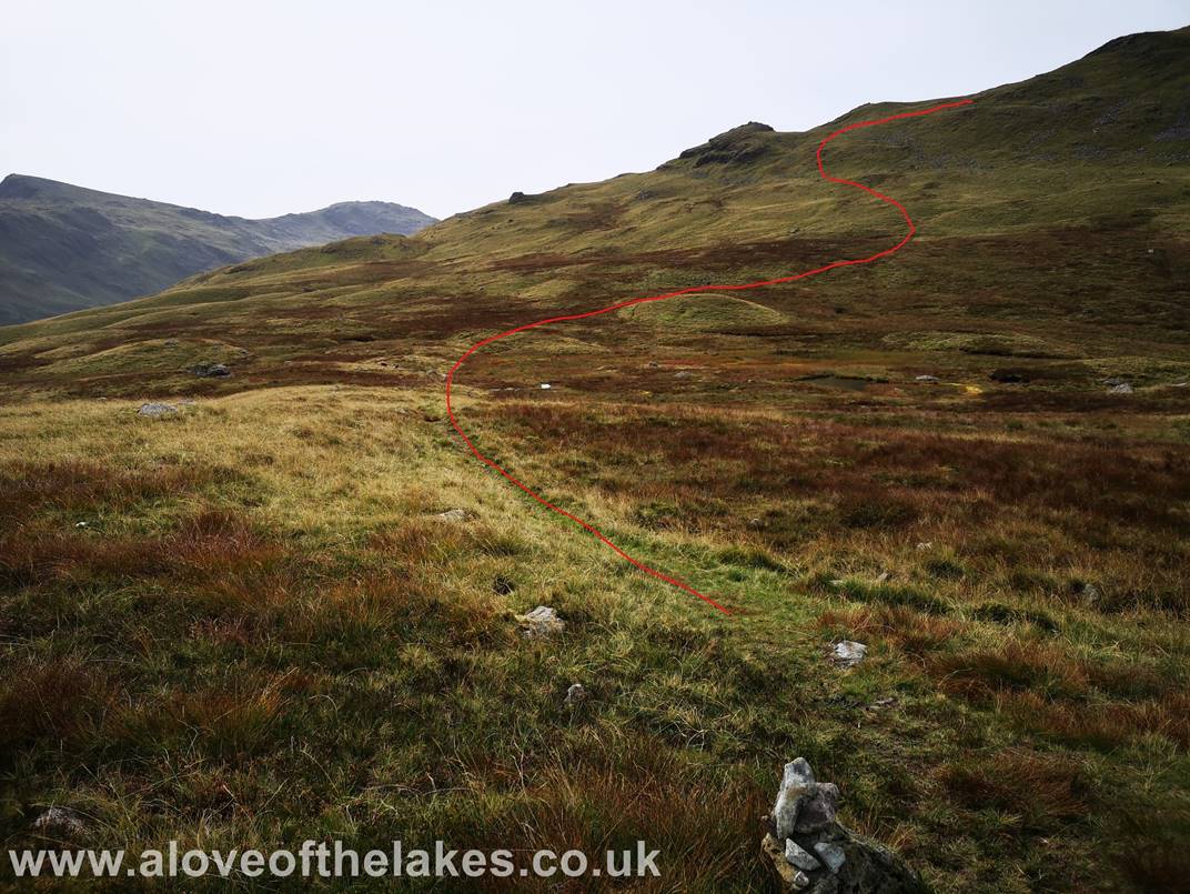 Following the grass path over boggy ground to get on to the summit ridge line