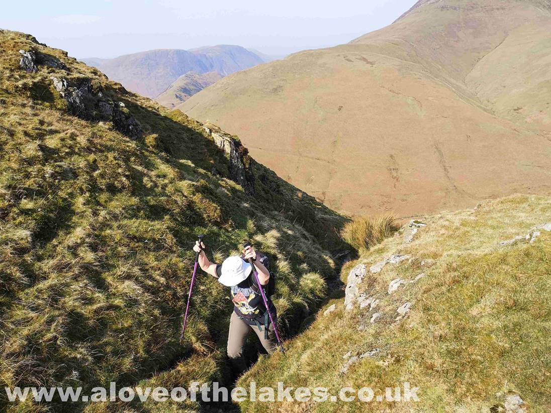 The rocky path twists and turns several times before emerging to flatter ground on High Snockrigg