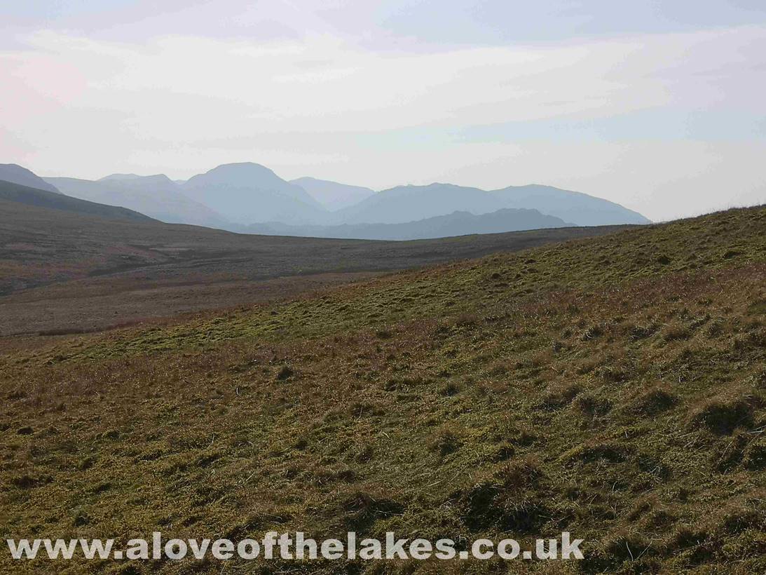 The grass path continues to meander to roughly the highest part of High Snockrigg before it swings left to descend
and cross Buttermere Moss, which can in parts be a little boggy
