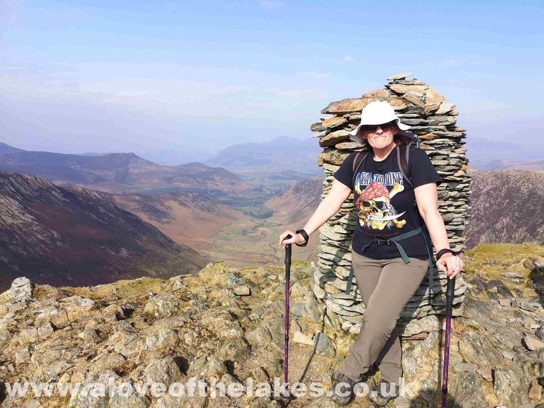 Sue on the summit of Dale Head with the beautiful Newlands valley below