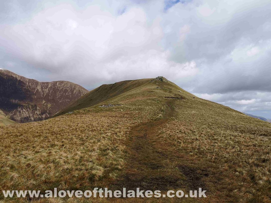 After the initial steep pull up to the first rock outcrop the path levels off as it leads towards the summit