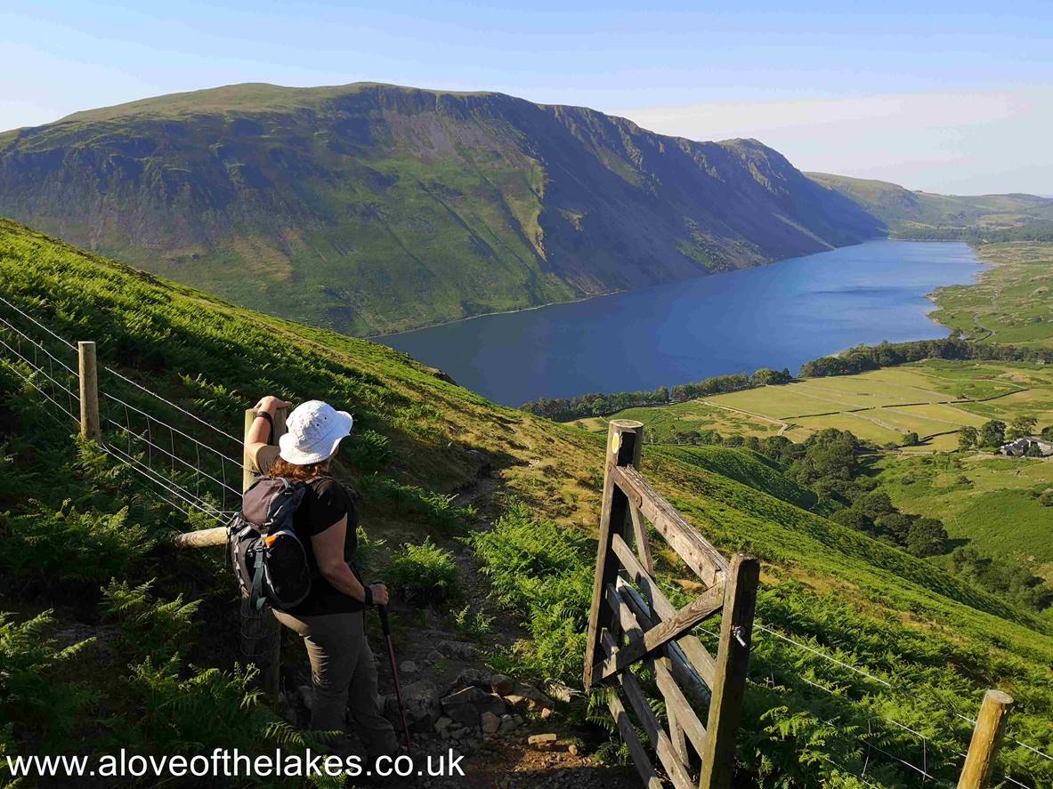 Through the gate and Sue pauses to look back at the wonderful view of Wast Water and the Screes