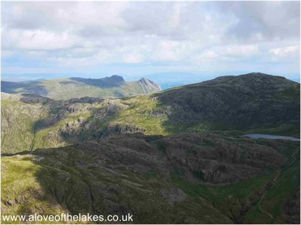 One of many pauses for breath, here looking over Sprinkling Tarn and Allen Crags to the Langdale Pikes