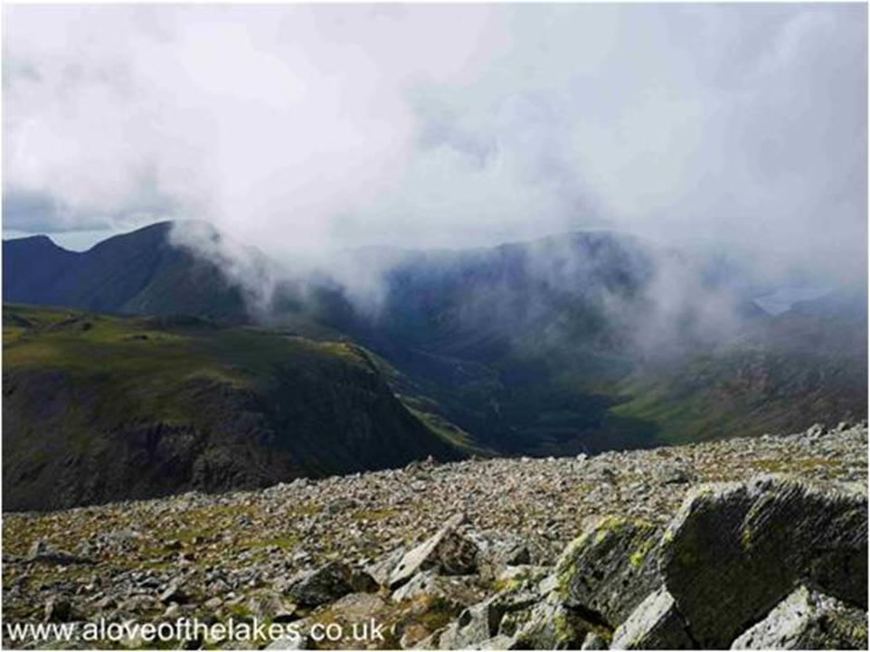 As we approach the summit a bank of cloud descends and quickly blots out our view down the Ennerdale Valley