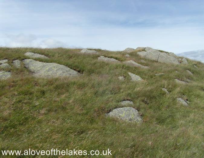 The rock outcrops before the summit