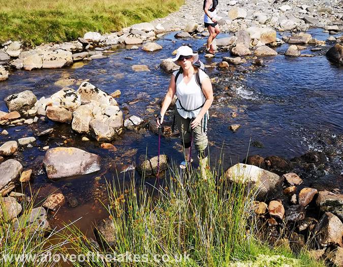 Sue crosses the River Caldew