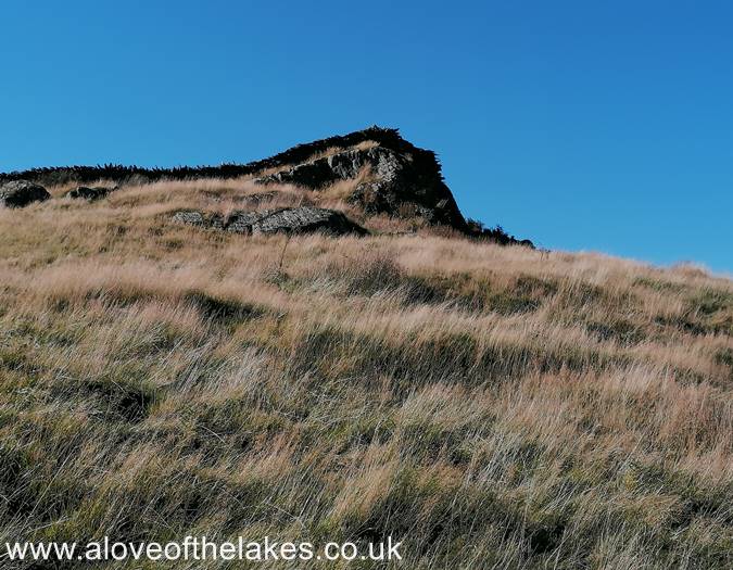 The wall over the boulder